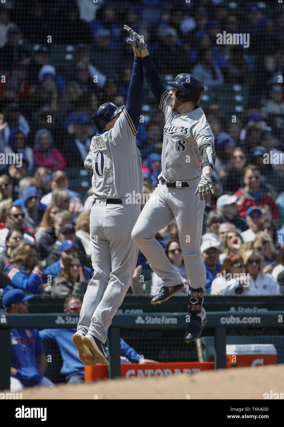 Milwaukee Brewers' Ryan Braun (R) celebrates with third base coach Ed Sedar (L) after hitting a solo home run off of Chicago Cubs' Jose Quintana in the fourth inning at Wrigley Field on May 10, 2019 in Chicago. Photo by Kamil Krzaczynski/UPI Stock Photo