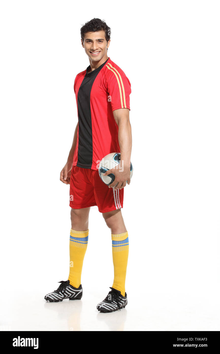 Portrait of a man holding a soccer ball Stock Photo - Alamy