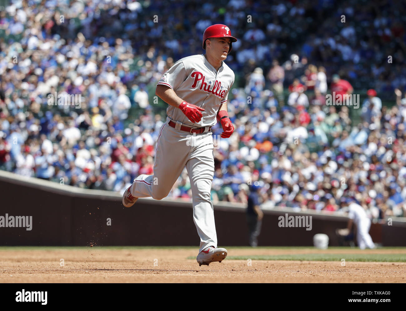 Philadelphia Phillies' J.T. Realmuto rounds the bases after hitting a solo home run against the Chicago Cubs in the third inning at Wrigley Field on May 23, 2019 in Chicago. Photo by Kamil Krzaczynski/UPI Stock Photo