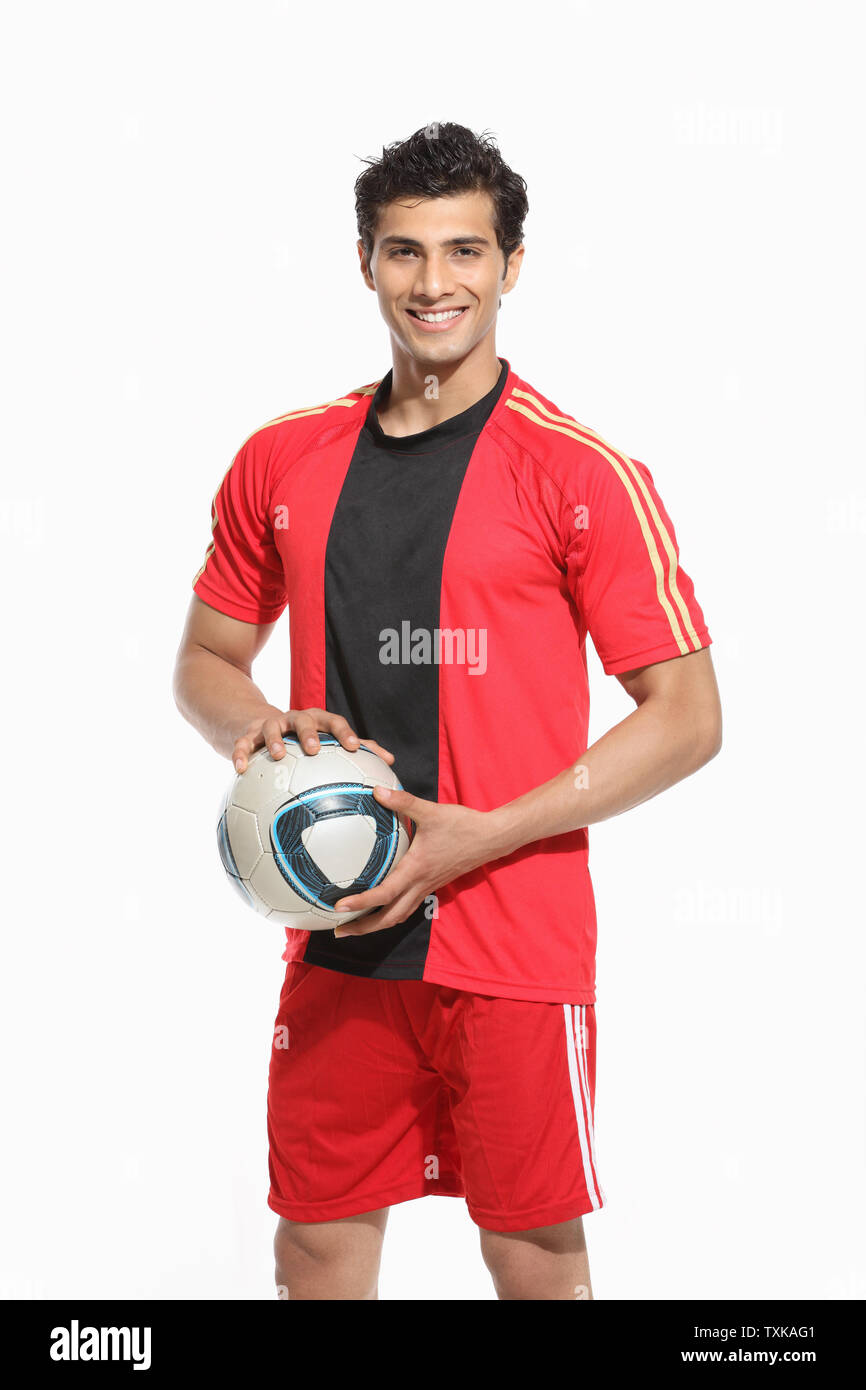 Portrait of a man holding a soccer ball Stock Photo - Alamy
