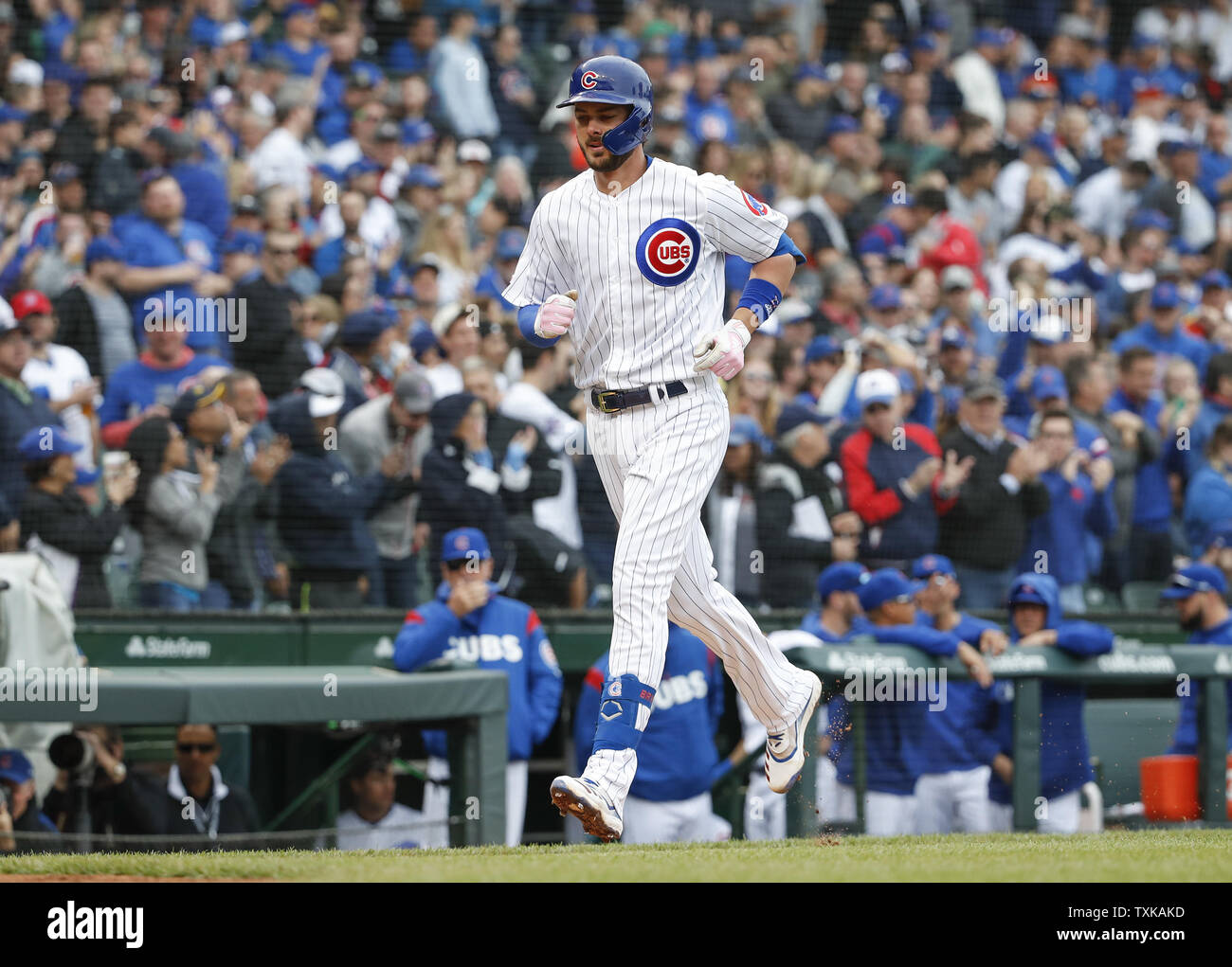 Chicago Cubs' Kris Bryant (R) rounds the bases after hitting two-run home run against the Cincinnati Reds in the third inning at Wrigley Field on May 24, 2019 in Chicago. Photo by Kamil Krzaczynski/UPI Stock Photo