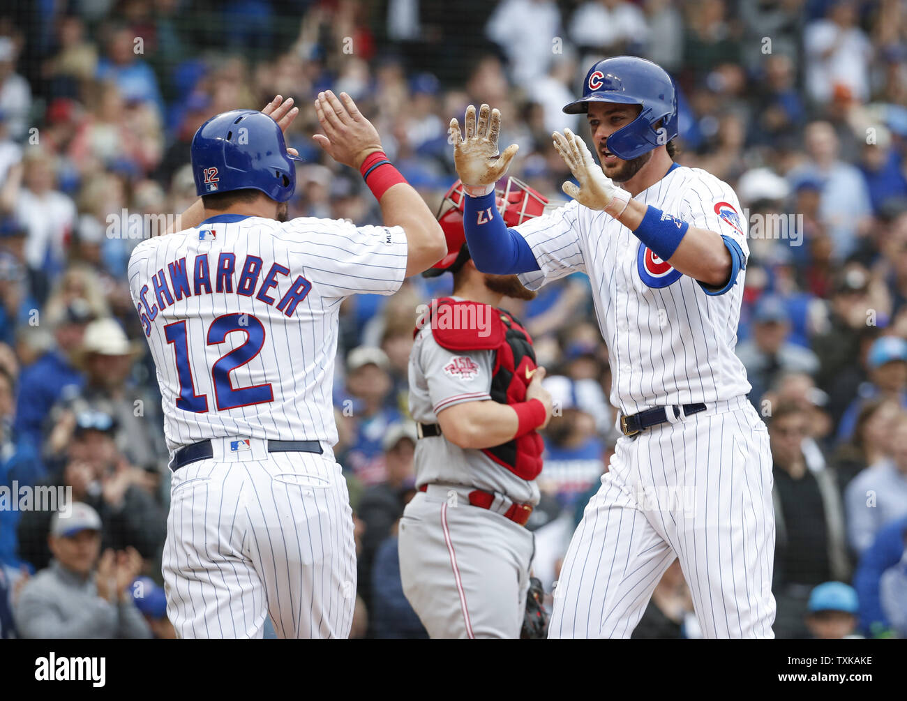 Chicago Cubs' Kris Bryant (R) celebrates with Kyle Schwarber (L) after hitting two-run home run against the Cincinnati Reds in the third inning at Wrigley Field on May 24, 2019 in Chicago. Photo by Kamil Krzaczynski/UPI Stock Photo