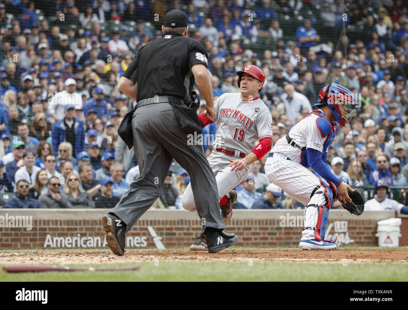 Cincinnati Reds' Joey Votto scores against the Chicago Cubs in the fourth inning at Wrigley Field on May 24, 2019 in Chicago. Photo by Kamil Krzaczynski/UPI Stock Photo