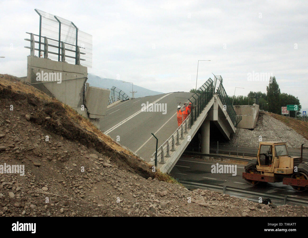 Workers survey a damaged highway in Curico, Chile on March 2, 2010. Areas of Chile have been devastated and hundreds have died after an 8.8 magnitude earthquake struck the country on February 27. UPI/Roberto Baez Stock Photo