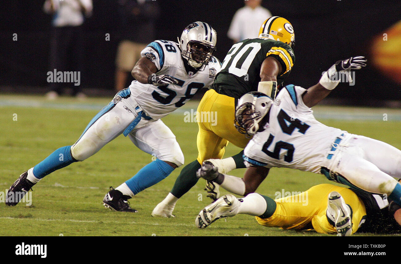 Green Bay Packers running back Ahman Green (30) darts between Carolina