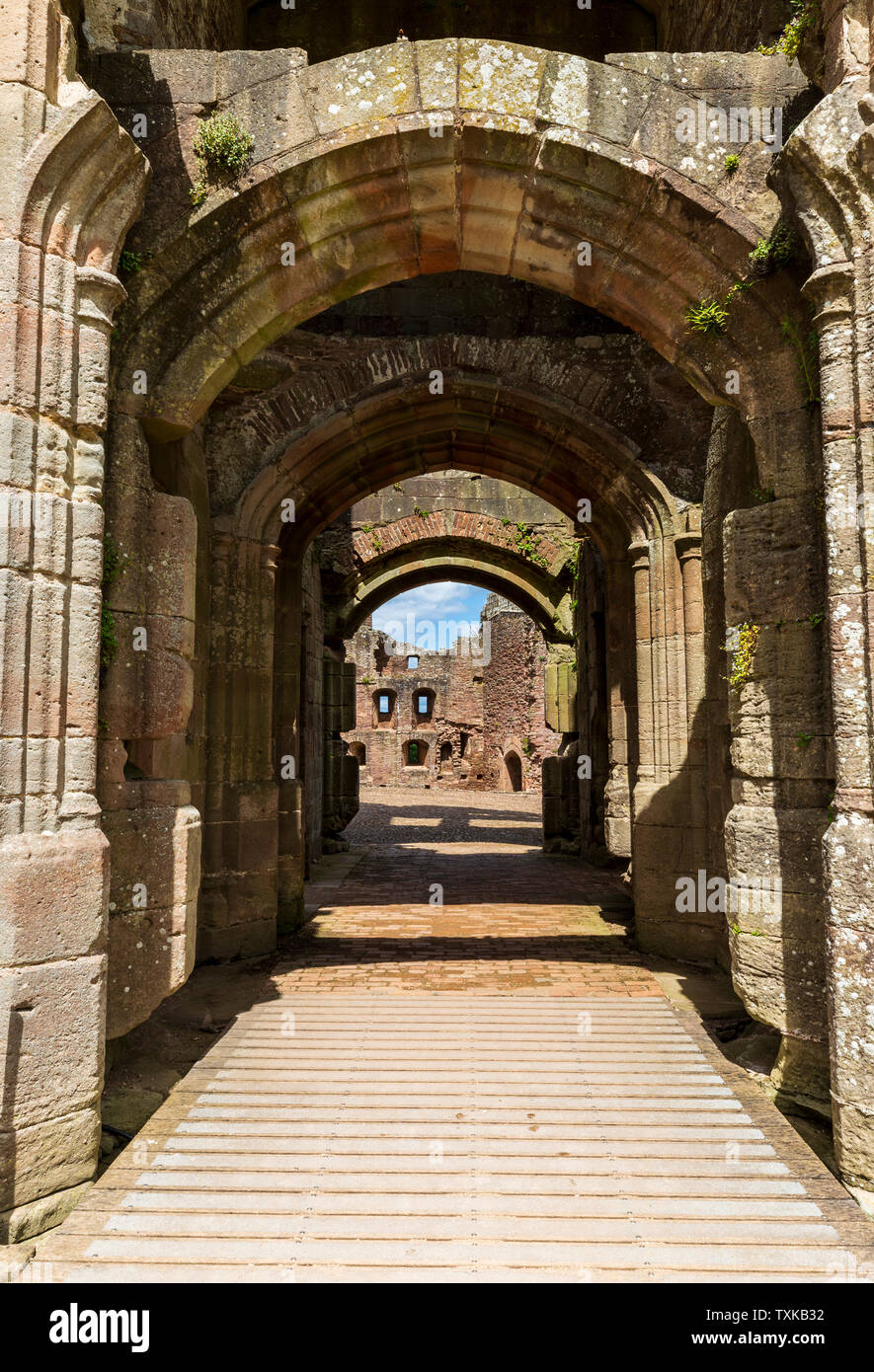 A view through the Main Gate into the Pitched Stone Court at Raglan Castle, Wales Stock Photo