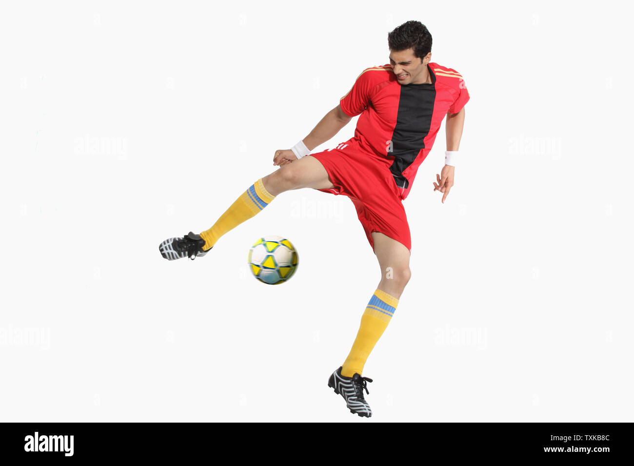 Man playing soccer Stock Photo - Alamy