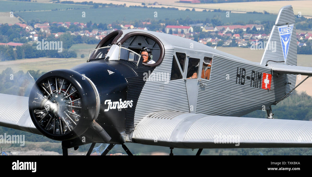 25 June 2019, Saxony-Anhalt, Dessau-Roßlau: The pilots Dieter Morszeck and Kurt Waldmeier steer the Junkers F 13 via Dessau. Exactly 100 years ago, an aircraft of this type took off for the first time in Dessau. The aircraft, designed by aircraft pioneer Hugo Junkers, was the world's first all-metal commercial aircraft and is regarded as a pioneer in civil aviation. Since 2016, the machine has again been manufactured in small series in Switzerland. The 100th anniversary of the first flight will be celebrated in Dessau with an airport festival, which will also include demonstration flights. Pho Stock Photo