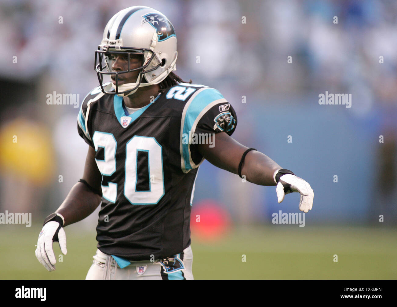 Carolina Panthers cornerback Chris Gamble (20) motions for a defensive coverage change in the first quarter against the New York Jets at Bank of America Stadium November 13, 2005 in Charlotte, NC.   (UPI Photo/Bob Carey) Stock Photo