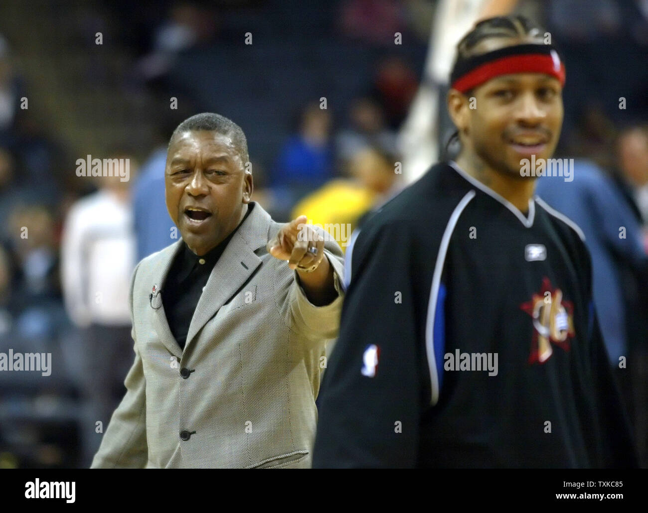 Charlotte Bobcats owner Robert Johnson, left, talks with Philadelphia 76ers guard Allen Iverson before a game at the Charlotte Bobcats Arena in Charlotte, N.C. on February 8, 2006. (UPI Photo/Nell Redmond) Stock Photo