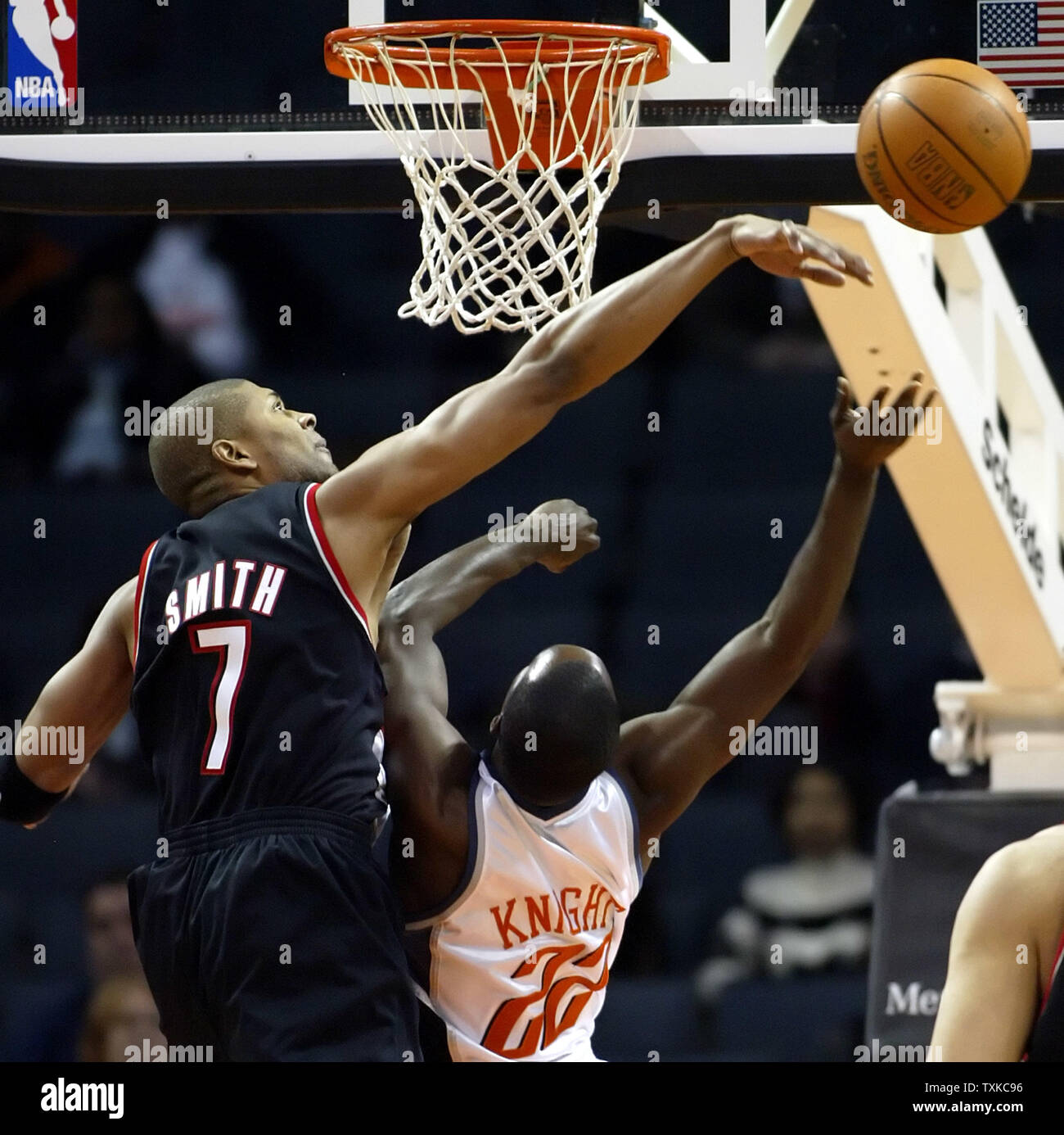 Portland Trail Blazers guard Charles Smith, left, blocks the shot of Charlotte Bobcats guard Brevin Knight at the Charlotte Bobcats Arena in Charlotte, N.C. on February 13, 2006. (UPI Photo/Nell Redmond) Stock Photo