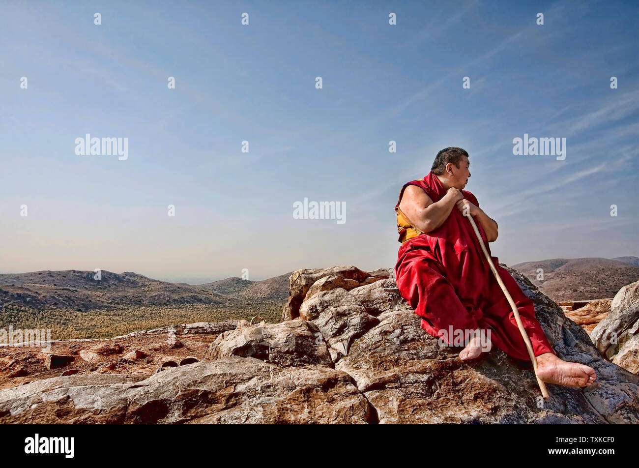 A Monk sitting on the Eagle (Vulture) Peak where Shakyamuni Buddha preached the Lotus Sutra, Rajgir, Rajagriha, Bihar, India. Stock Photo