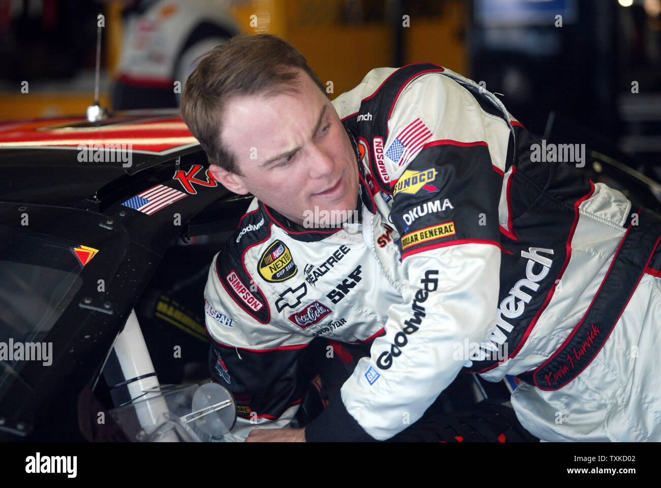 NASCAR driver Kevin Harvick checks his GM Goodwrench Chevrolet before the start of practice for the Bank of America 500 NASCAR Nextel Cup race at the Lowe's Motor Speedway near Charlotte, N.C., on October 12, 2006. (UPI Photo/Nell Redmond) Stock Photo