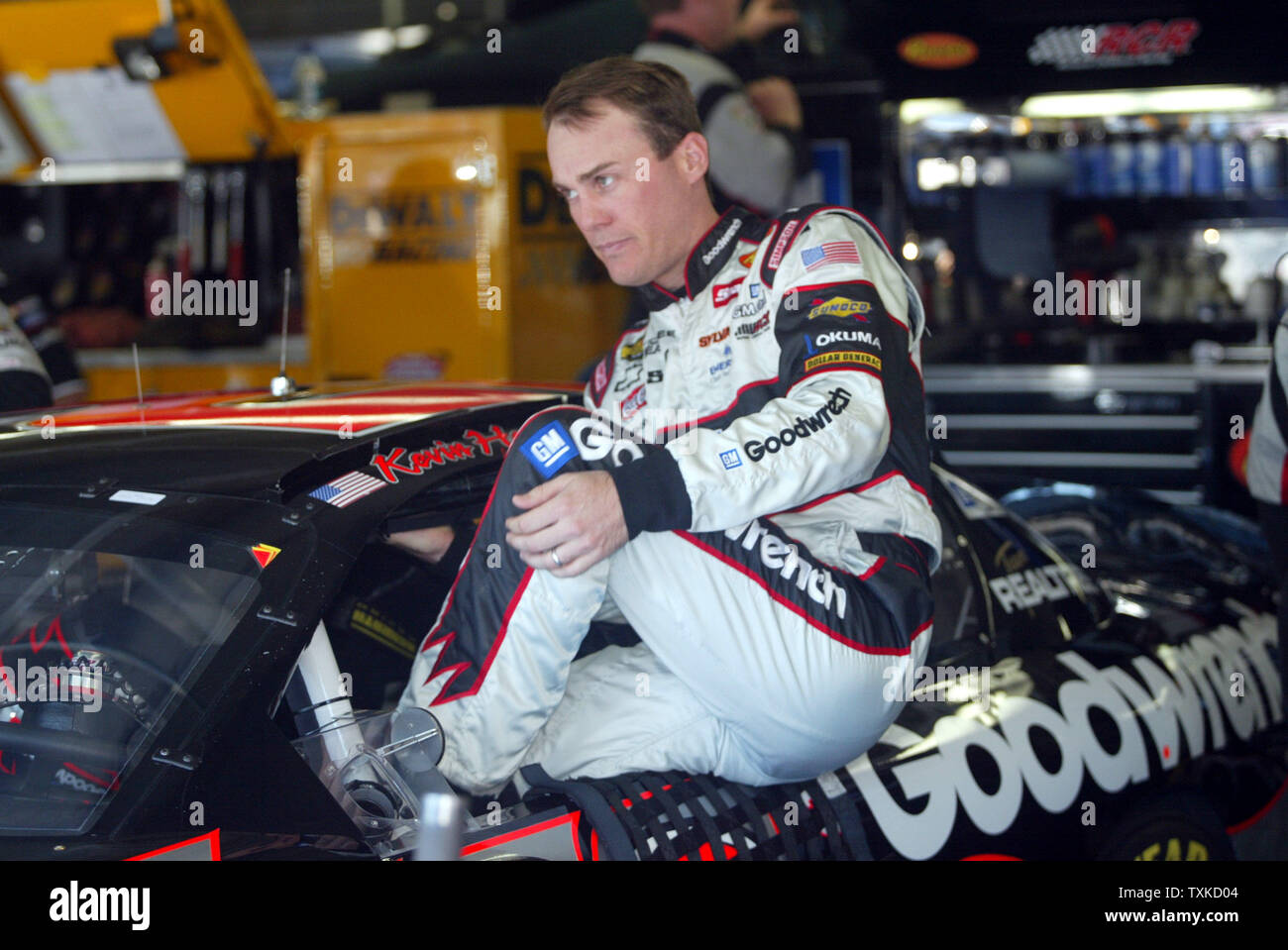 NASCAR driver Kevin Harvick climbs into his GM Goodwrench Chevrolet before the start of practice for the Bank of America 500 NASCAR Nextel Cup race at the Lowe's Motor Speedway near Charlotte, N.C., on October 12, 2006. (UPI Photo/Nell Redmond) Stock Photo