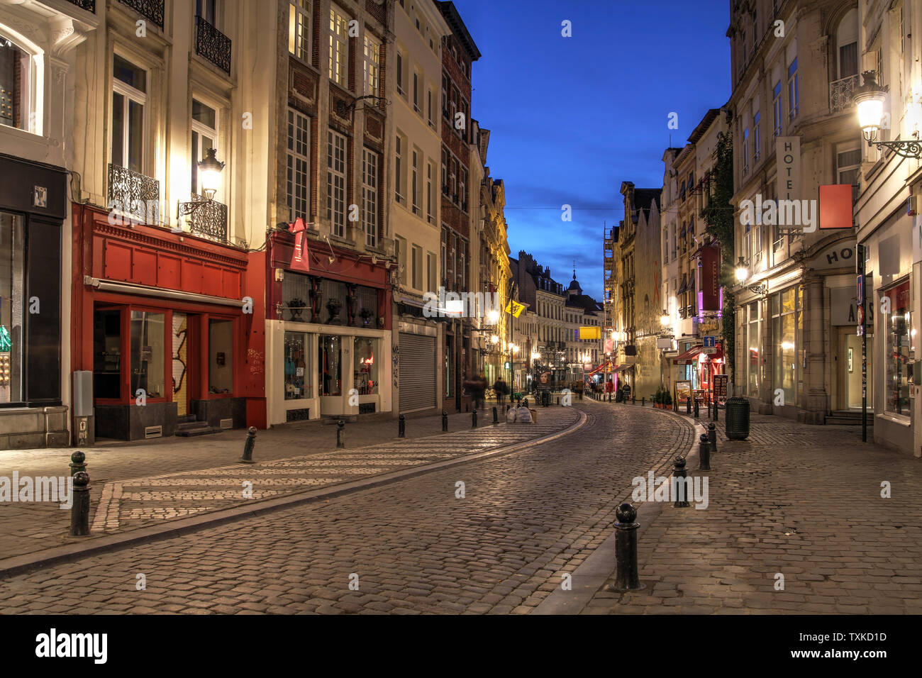 A winding street in downtown Brussels, Belgium at night. Stock Photo