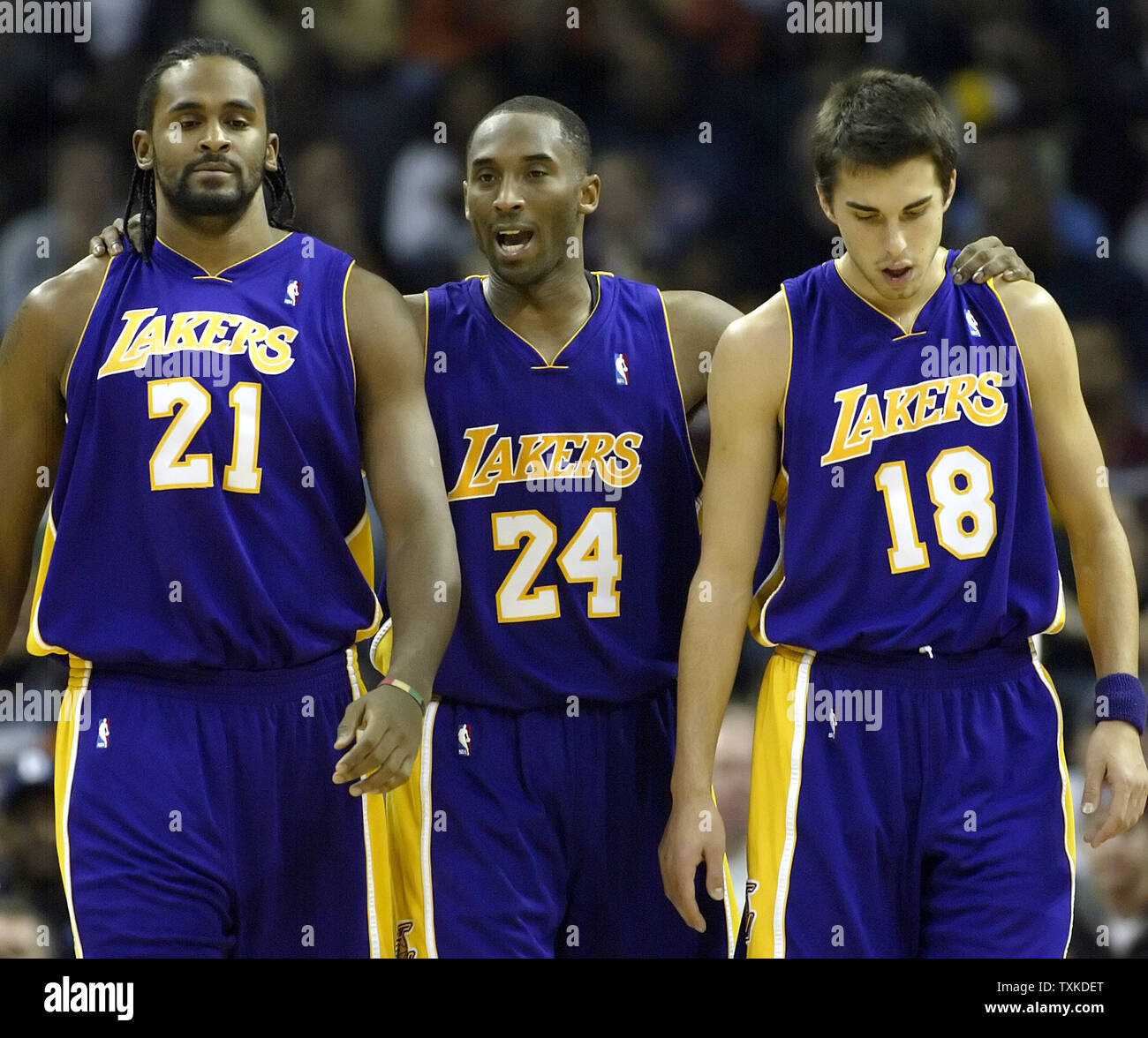 Los Angeles Lakers guard Kobe Bryant, center, talks to teammates Ronny Turiaf, left, and Sasha Vujacic of Slovenia during a timeout as his team plays the Charlotte Bobcats at the Charlotte Bobcats Arena in Charlotte, N.C. on December 29, 2006. (UPI Photo/Nell Redmond) Stock Photo
