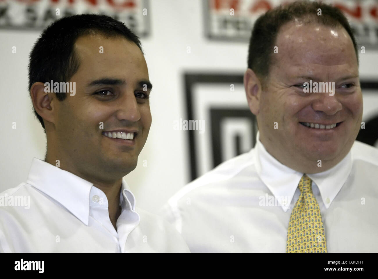 NASCAR driver Juan Pablo Montoya of Colombia, left, and team owner Chip Ganassi laugh during a press conference at Chip Ganassi Racing in Concord, NC on January 22, 2007 during the NASCAR NEXTEL Cup Media Tour. (UPI Photo/Nell Redmond) Stock Photo