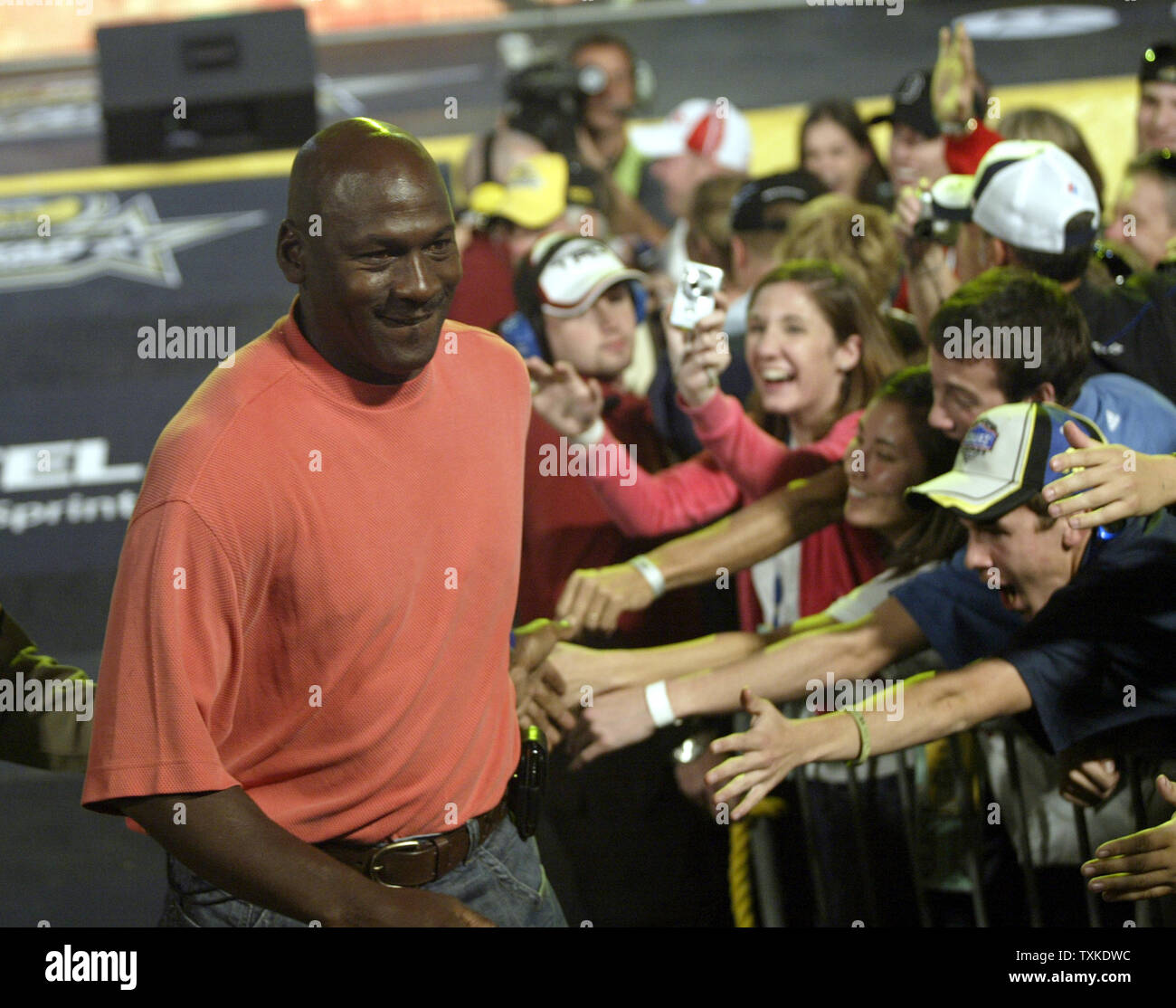 Fans reach for NBA legend Michael Jordan after he was introduced as the Grand Marshall of the NASCAR All-Star Challenge race at the Lowe's Motor Speedway near Charlotte, North Carolina on May 19, 2007. The All-Star Challenge is a special non-points race featuring NASCAR's top drivers racing for a record $3,264,364 purse.   (UPI Photo/Nell Redmond) Stock Photo
