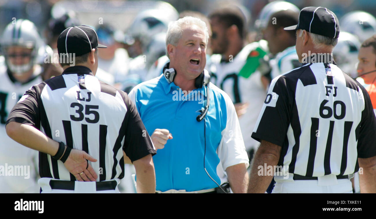 Carolina Panthers head coach John Fox discusses a call with Line Judge John Hussey (35) and Field Judge Gary Cavaletto in the first quarter of the game against the Houston Texans at Bank of America Stadium in Charlotte, North Carolina on September 16, 2007 .    (UPI Photo/Bob Carey) Stock Photo