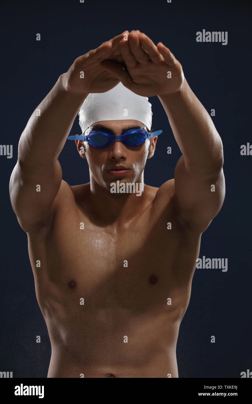 Man wearing swimming cap and goggles Stock Photo