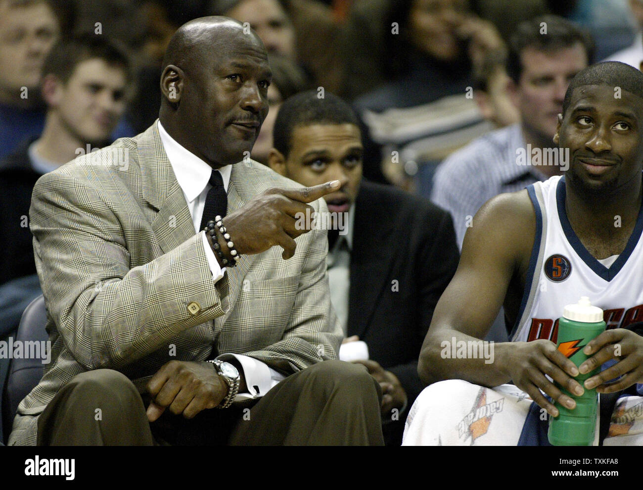 Charlotte Bobcats part owner and managing member of basketball operations Michael Jordan, left, talks with guard Raymond Felton as the Bobcats defeat the Boston Celtics 114-106 in overtime in Charlotte, North Carolina on January 6, 2009. (UPI Photo/Nell Redmond) Stock Photo