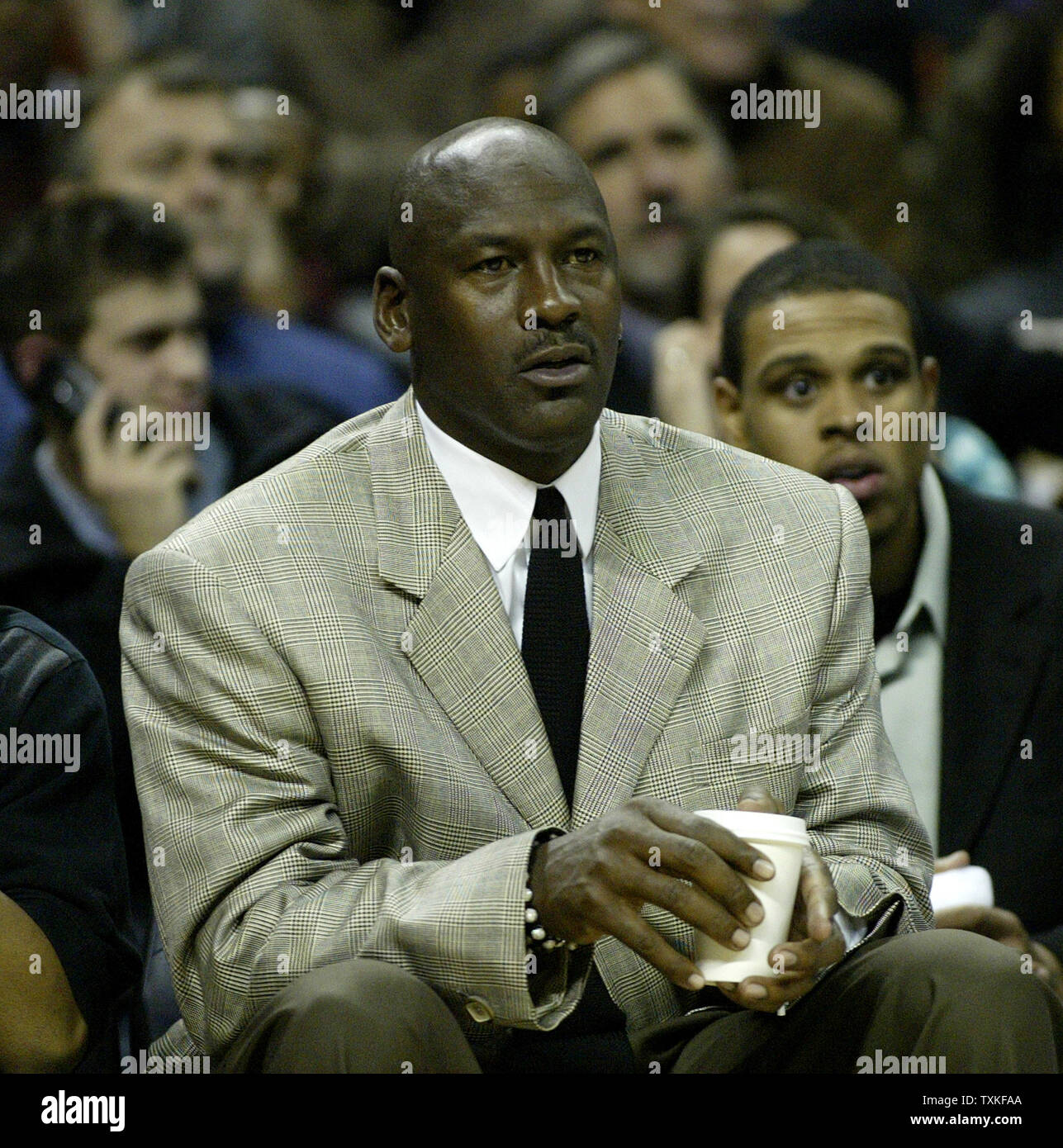 Charlotte Bobcats part owner and managing member of basketball operations Michael Jordan watches his Charlotte Bobcats as they defeat the Boston Celtics 114-106 in overtime in Charlotte, North Carolina on January 6, 2009. (UPI Photo/Nell Redmond) Stock Photo