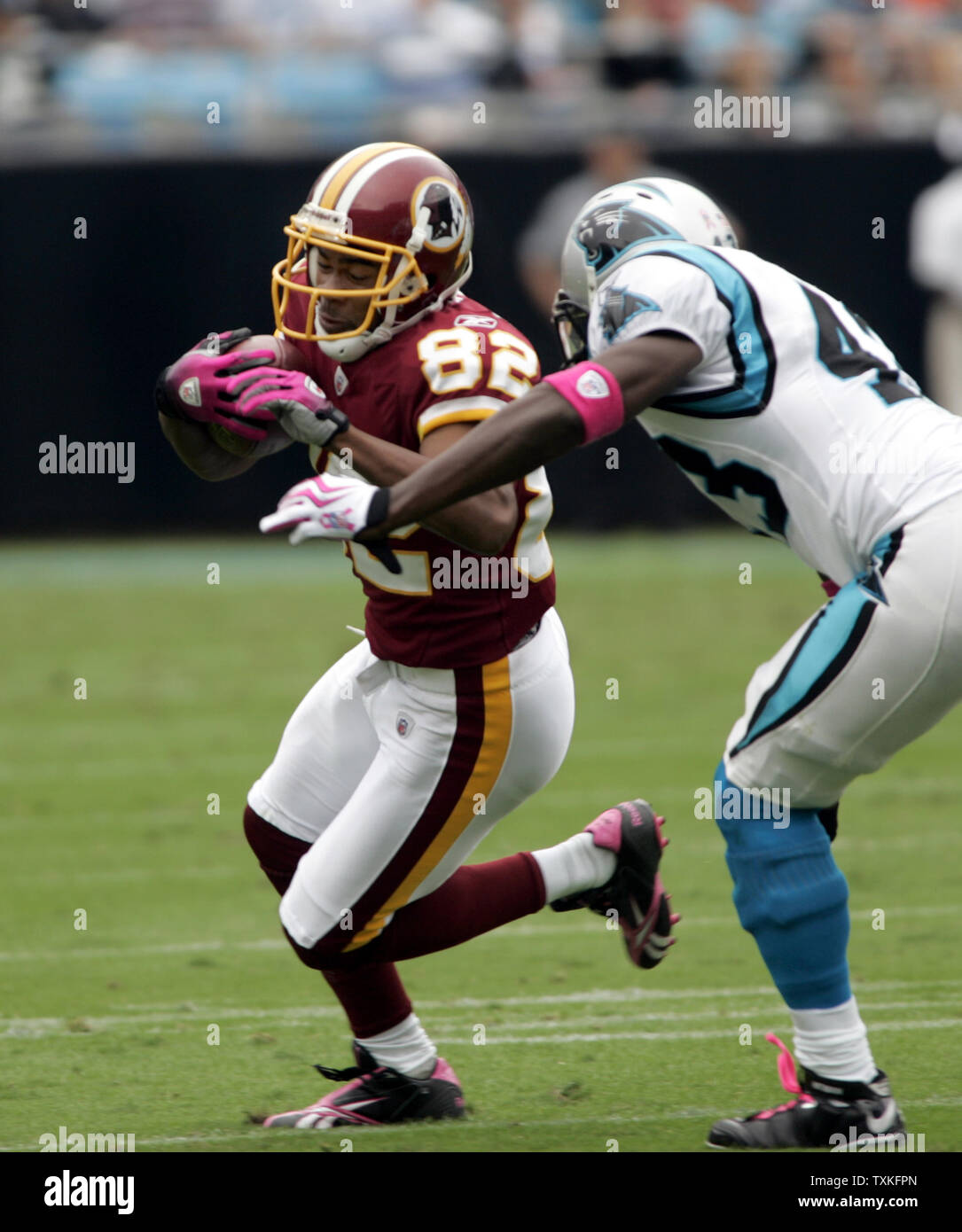 Washington Redskins wide receiver Antwaan Randle El tries to turn the corner against Carolina Panthers safety Chris Harris at Bank of America Stadium in Charlotte, North Carolina on October 11, 2009.   UPI/Nell Redmond . Stock Photo