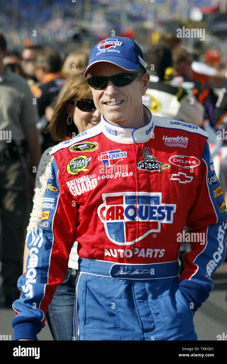 Race car driver Mark Martin walks through the pits before the start of ...