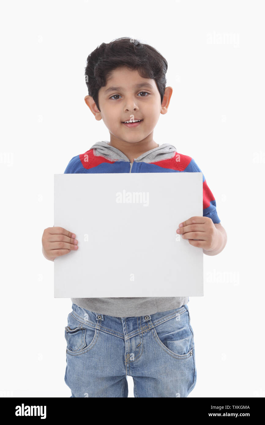Portrait of a boy holding a placard Stock Photo Alamy