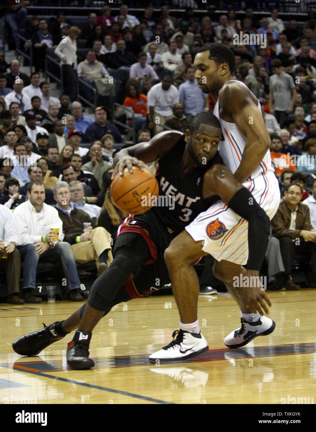 Miami Heat Guard Dwyane Wade Left Drives Into Charlotte Bobcats Guard Gerald Henderson In An Nba Basketball Game In Charlotte North Carolina On December 28 11 Upi Nell Redmond Stock Photo Alamy