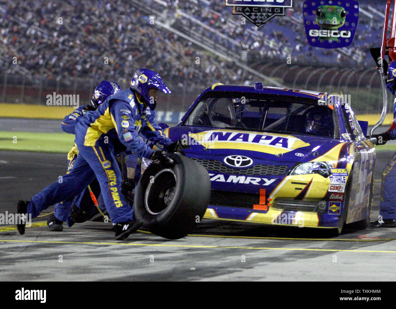 Crew members perform a pit stop for Mark Martin at the Bank of America 500 NASCAR Race at the Charlotte Motor Speedway in Concord, North Carolina on October 13, 2012.    UPI/Nell Redmond. Stock Photo