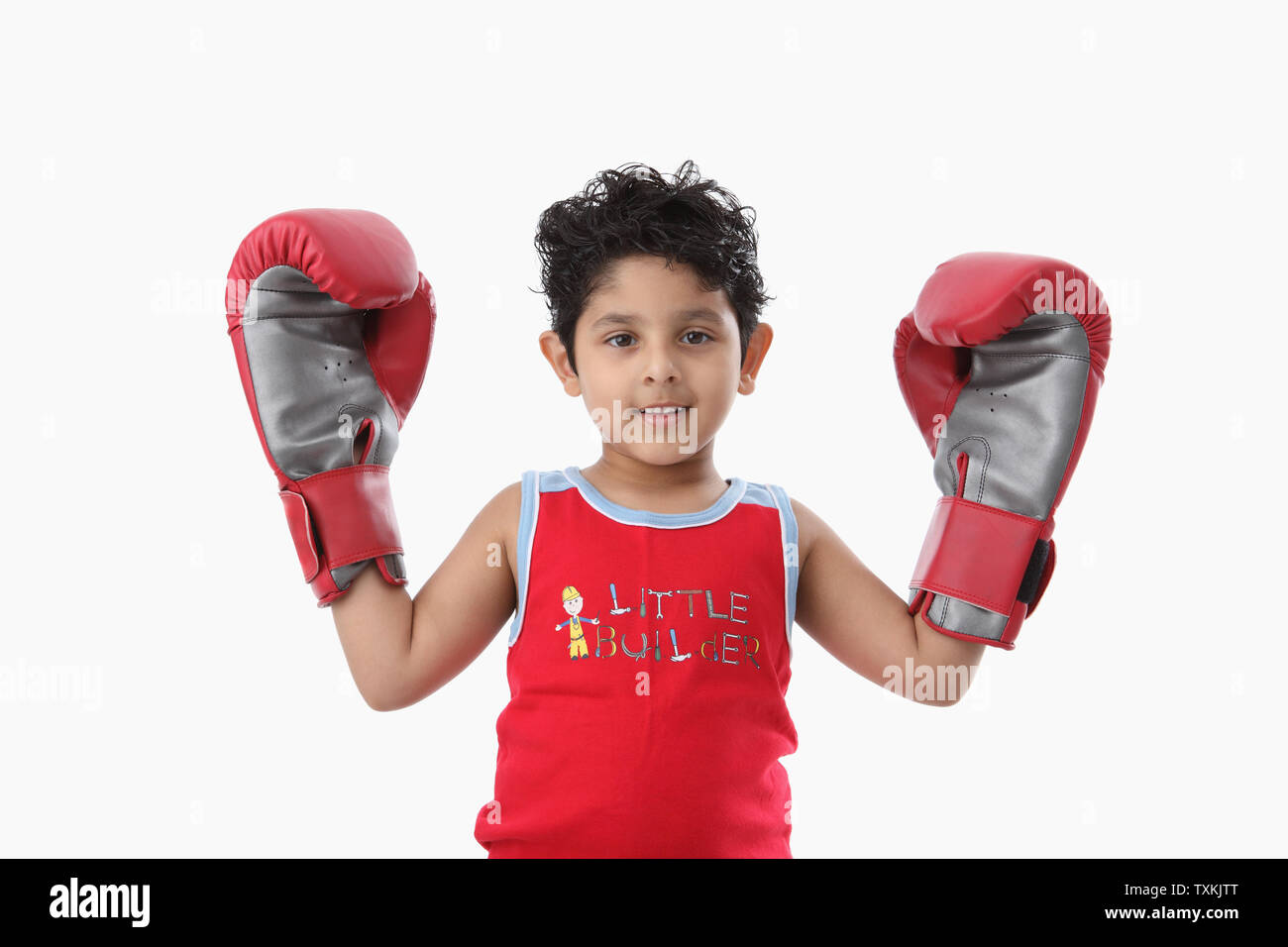 Portrait of a boy wearing boxing gloves Stock Photo Alamy