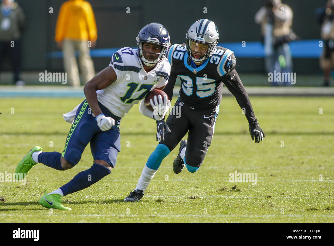 Seattle Seahawks wide receiver Malik Turner, left, looks for running