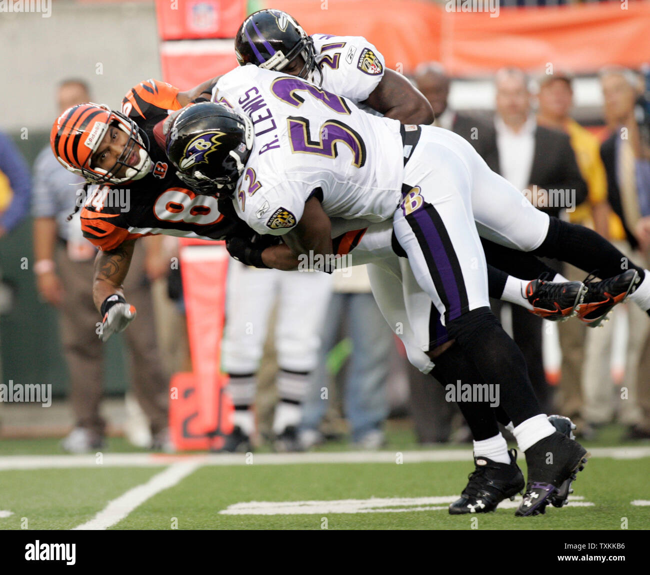 Cincinnati Bengals wide receiver T.J. Houshmandzadeh (L) is tackled by Baltimore Ravens Ray Lewis (52) and Chris McAlister (21) after a 12-yard catch at Paul Brown Stadium in Cincinnati on September 10, 2007. (UPI Photo/Mark Cowan) Stock Photo