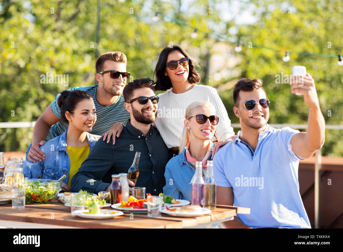 happy friends taking selfie at rooftop party Stock Photo - Alamy