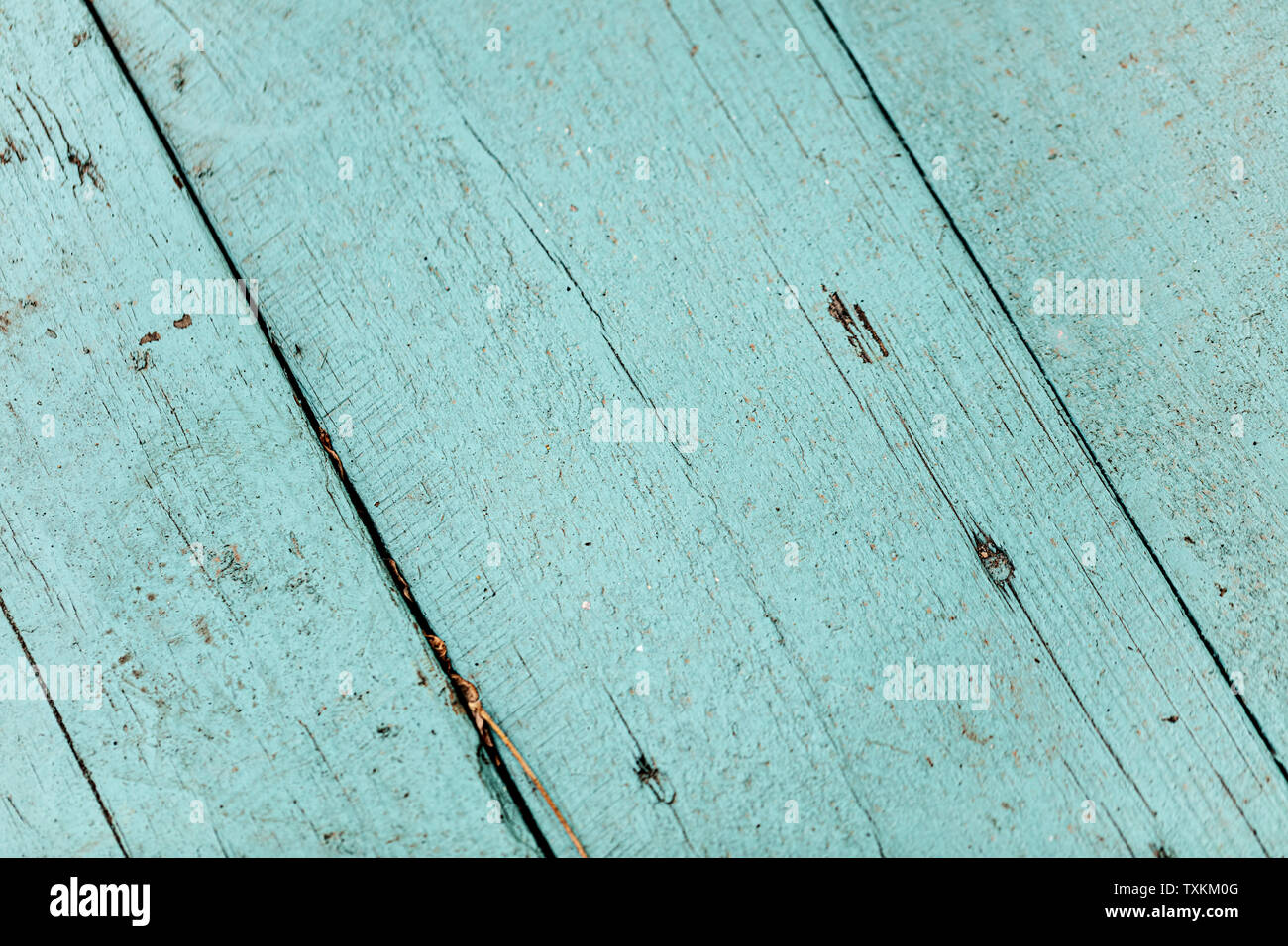 Old worn wooden background of blue and cyan. Blur effect. Stock Photo