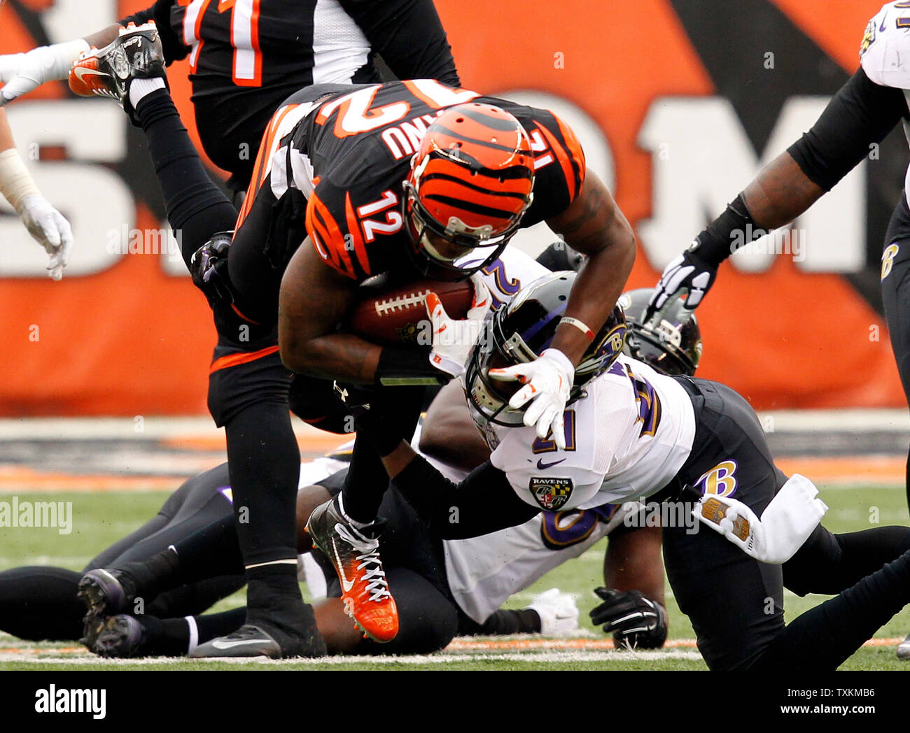 Cincinnati Bengals wide receiver Mohamed Sanu (12) is tackled by Baltimore Ravens' Lardarius Webb (21) during the first half of play at Paul Brown Stadium in Cincinnati, Ohio, January 3, 2016.      Photo by John Sommers II/UPI Stock Photo