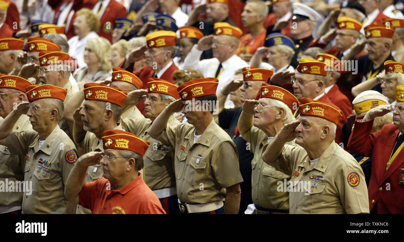Members of the Marine Corps. League salute during the invocation by Bishop Anthony Pilla during a memorial service for fallen Marines of the 3/25th Monday, Aug. 8, 2005 at the International Exposition Center in Cleveland.  (UPI Photo/Scott R. Galvin) Stock Photo