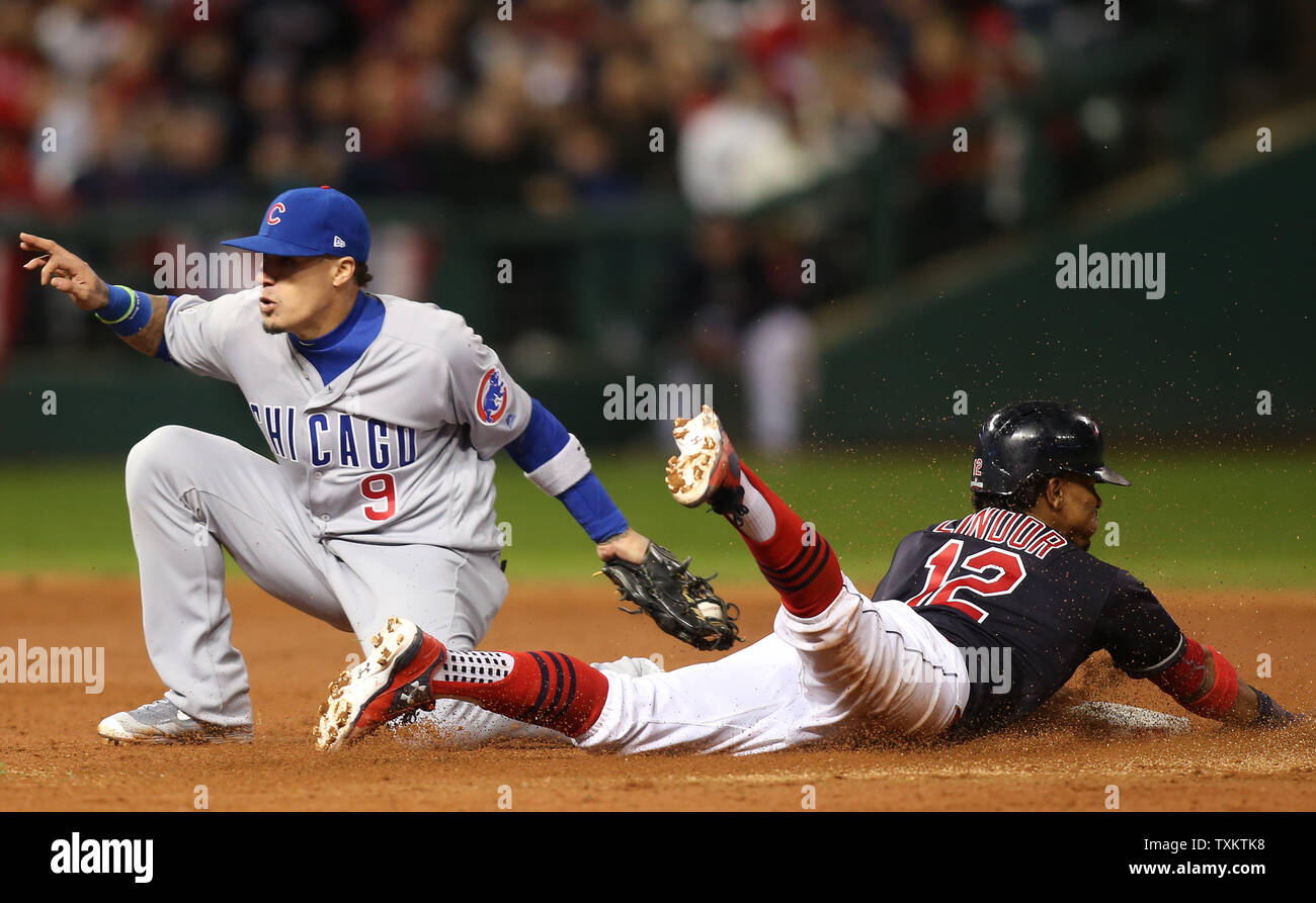 Chicago Cubs second baseman Javier Baez tags out Cleveland Indians  shortstop Francisco Lindor attempting to steal second base during the third  inning of game 1 of the World Series at Progressive Field
