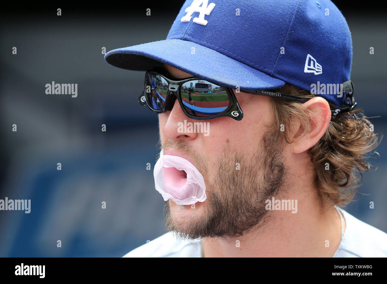 Los Angeles Dodgers Clayton Kershaw blows a bubble prior to a game