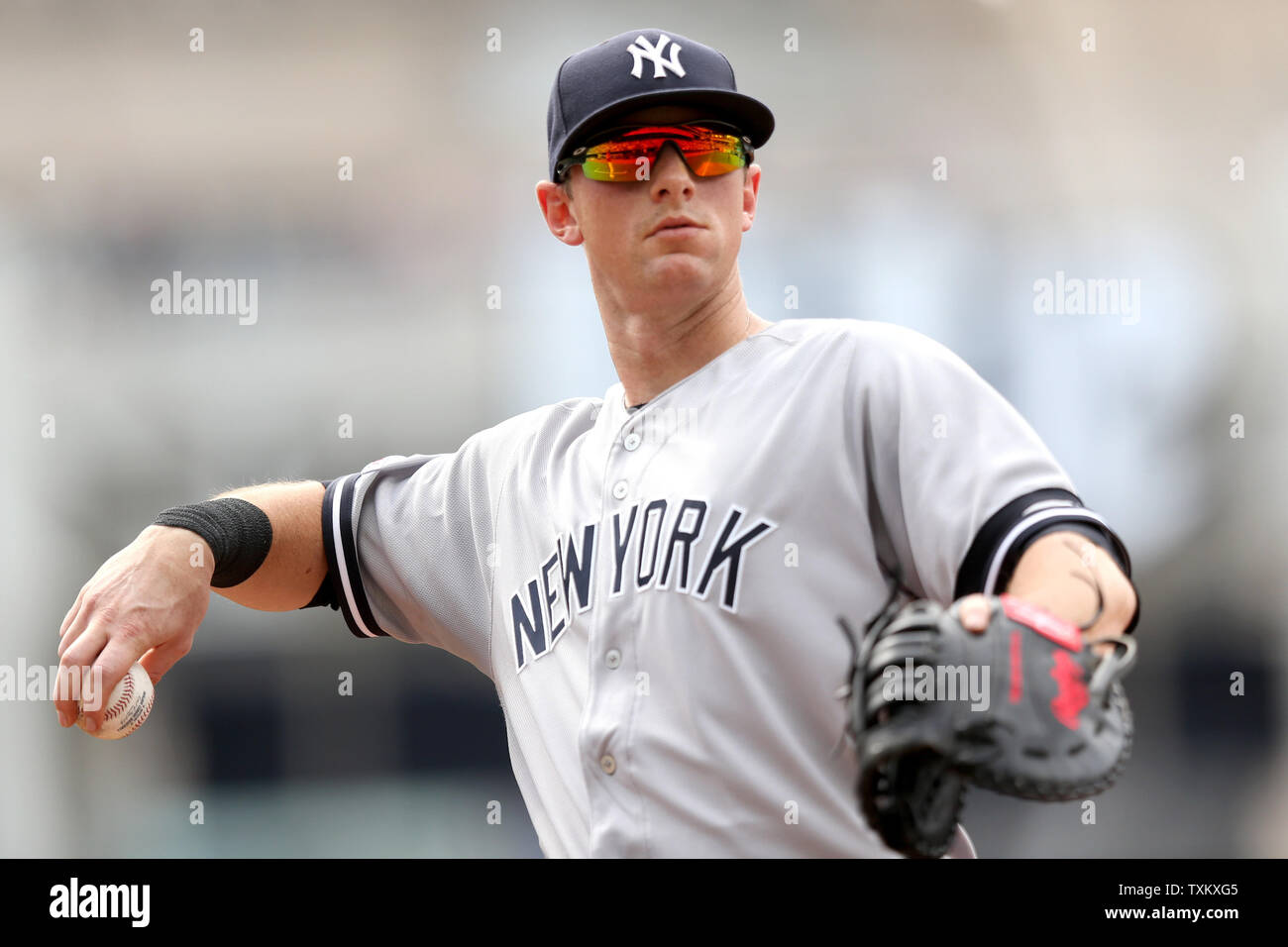 New York Yankees first baseman DJ LeMahieu looks to throw a ball