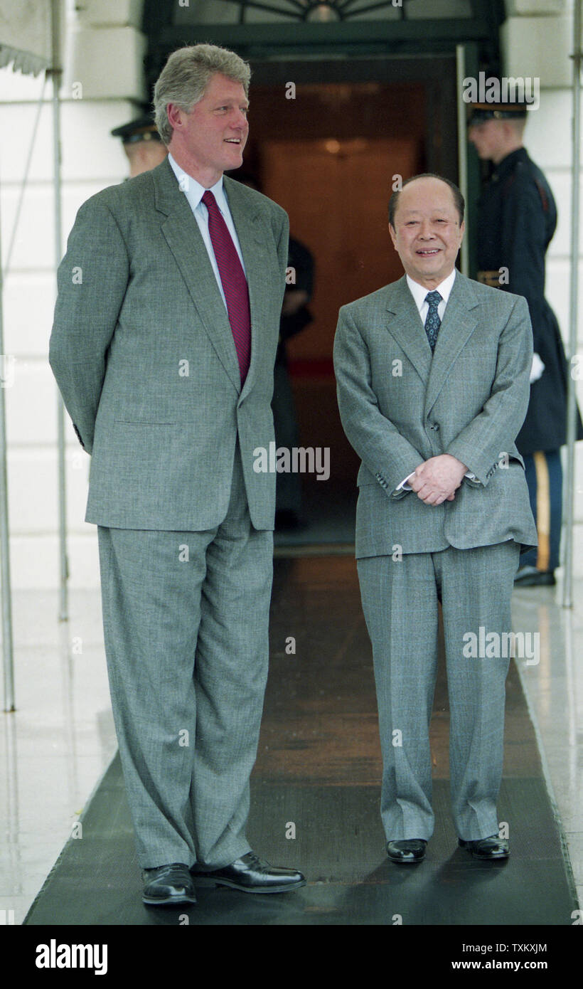U.S. President Bill Clinton and Japanese Prime Minister Kiichi Miyazawa (L) stand at the South Portico of the White House in Washington on April 16, 1993. UPI Stock Photo