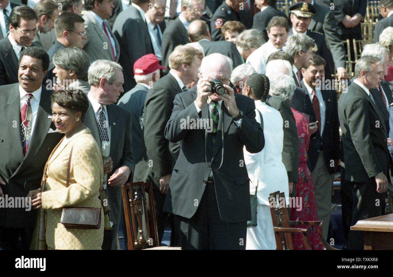Sen. Patrick Leahy (D-VT) takes photos on the South Lawn of the White House in Washington after a signing ceremony for the crime bill on September 13, 1994. UPI Stock Photo