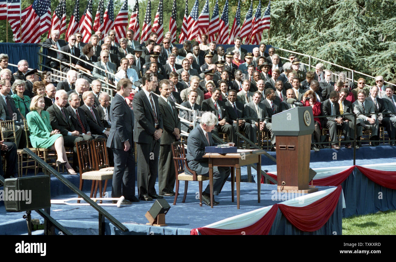 U.S. President Bill Clinton signs the crime bill during a ceremony on the South Lawn of the White House in Washington on September 13, 1994. UPI Stock Photo