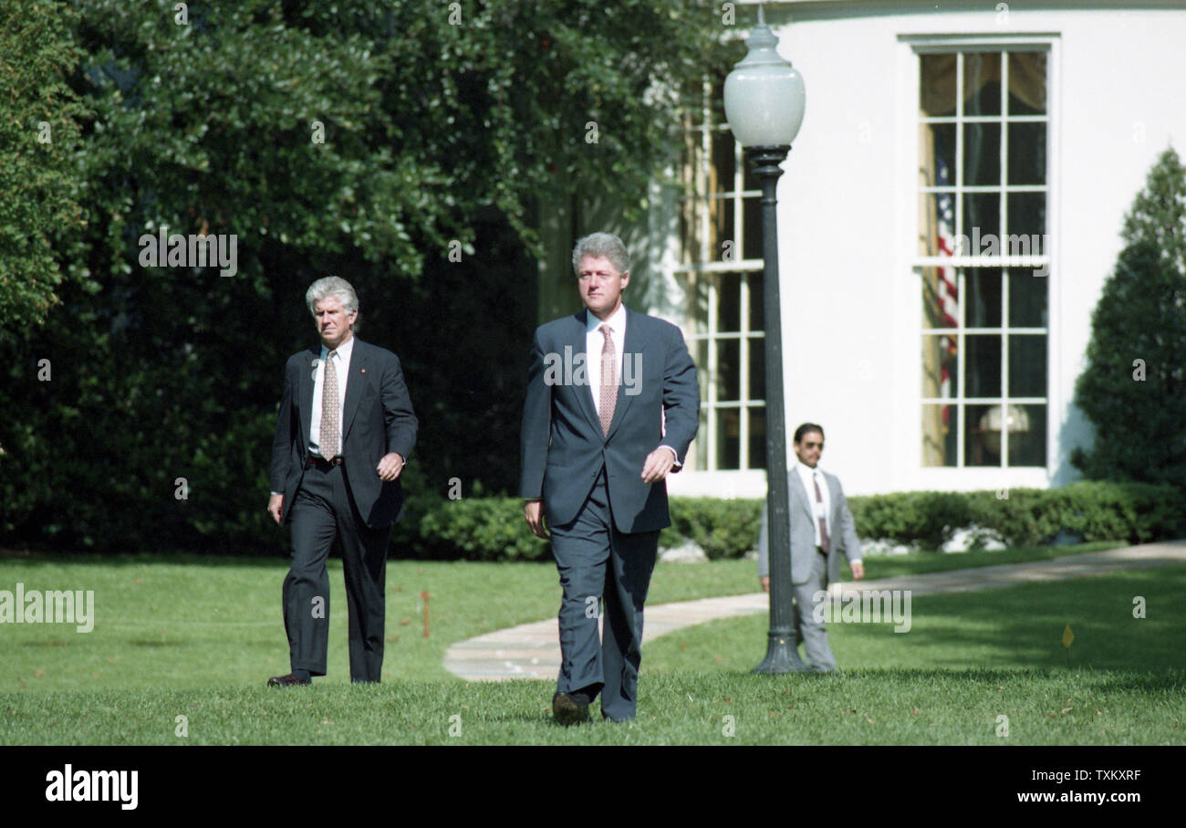 U.S. President Bill Clinton walks across the South Lawn of the White House in Washington to signing ceremony for the crime bill on September 13, 1994. UPI Stock Photo