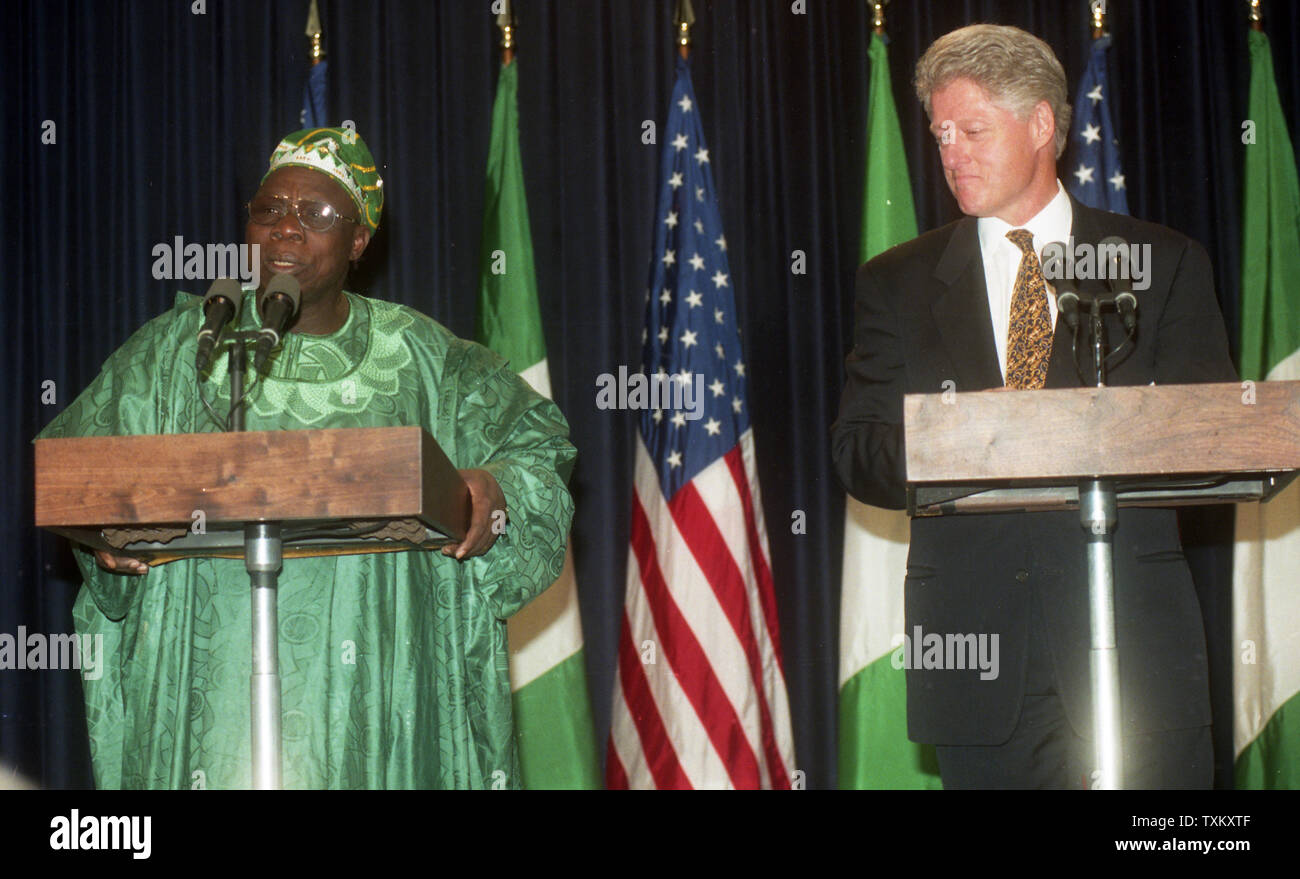U.S. President Bill Clinton (R) and Olusegun Obasanjo, President of Nigeria, speak at a joint news conference in Washington on October 28, 1999. UPI Stock Photo