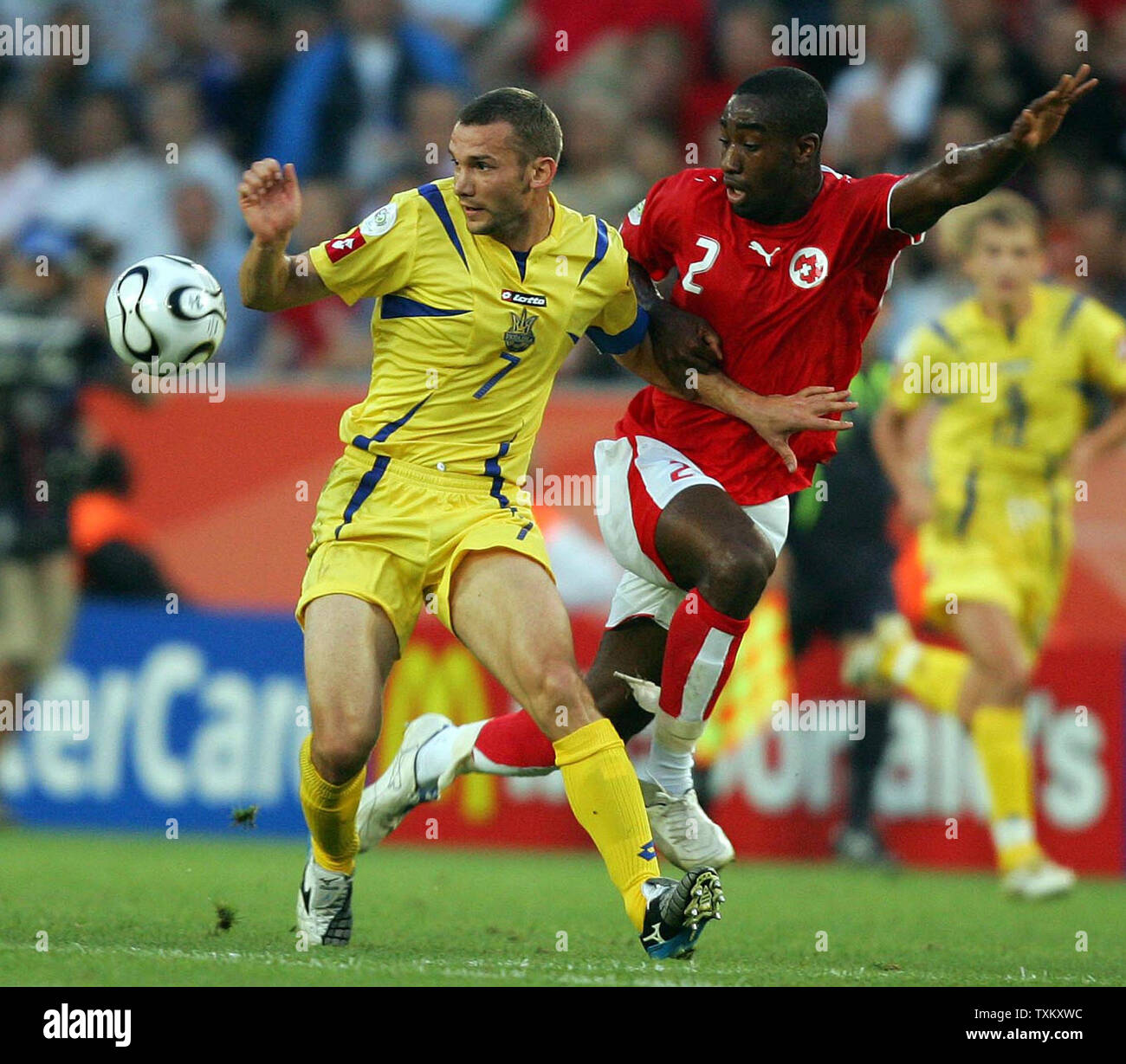 Switzerland's Johan Djourou (2) and Ukraine's Andriy Shevchenko (7) fight for the ball during FIFA World Cup 2006 soccer in Cologne, Germany on June 26, 2006. Ukraine eliminated Switzerland from the competition with a 3-0 win.  (UPI Photo/Christian Brunskill) Stock Photo