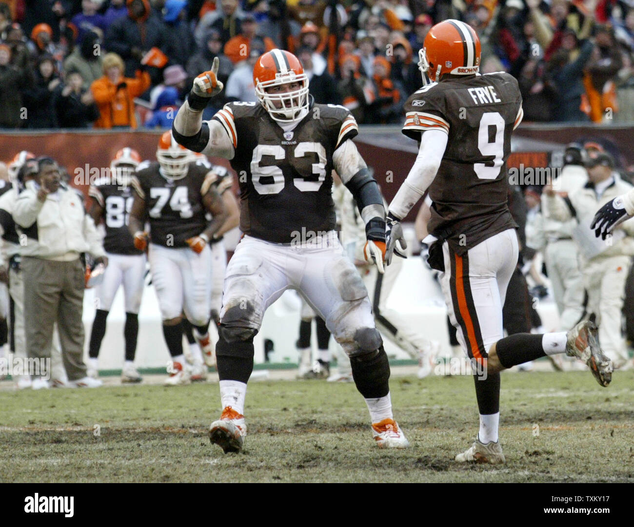 Cleveland Browns quarterback Charlie Frye (9) fumbles the football as he is  hit by Baltimore Ravens defensive end Terrell Suggs in the second quarter  at Cleveland Browns Stadium in Cleveland, OH on