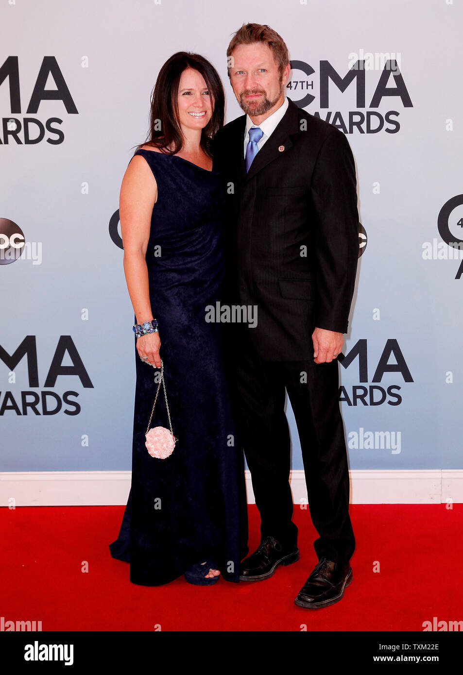 Craig Morgan arrives on the red carpet with a guest at the 47th Annual Country Music Awards at the Bridgestone Arena in Nashville, November 6, 2013. UPI/Terry Wyatt Stock Photo