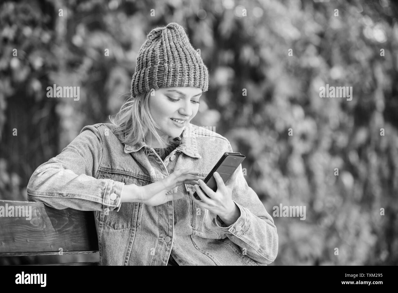 Stay touch with modern smartphone. Mobile call concept. Girl with smartphone green nature background. Woman having mobile conversation. Mobile communication and social networks. Girl call friend. Stock Photo